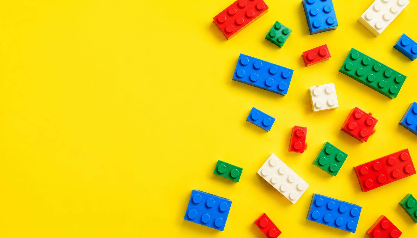 Colorful bricks scattered on yellow